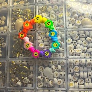 It is a rainbow flowered pattern clay bead bracelet